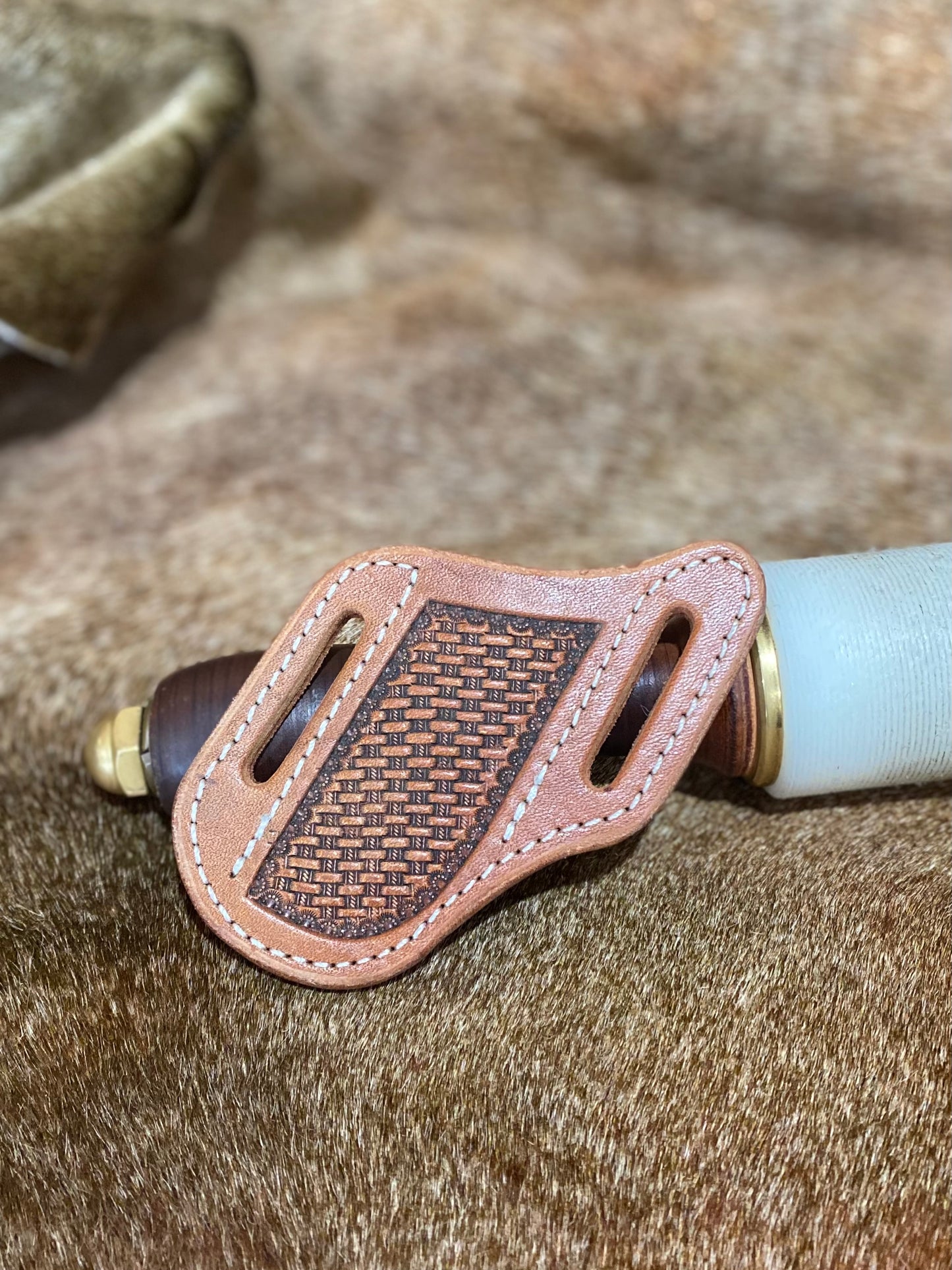 Basket stamped trapper sheath